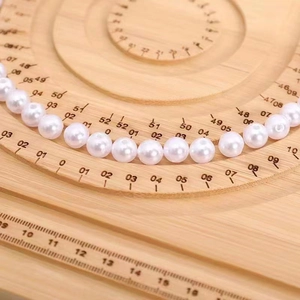 Wooden beaded jewelry design board with circular measuring tracks for necklaces and bracelets