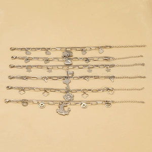 Set of six silver stainless steel double-layer bracelets with assorted fashion charms