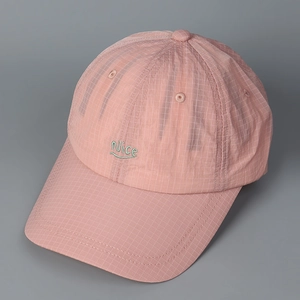 Close-up of pink plaid baseball cap with light green Nice embroidery and fine grid texture