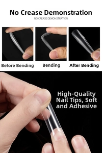 Macro shot of ultra-flexible XXXL clear nail tips showing no-crease bending quality