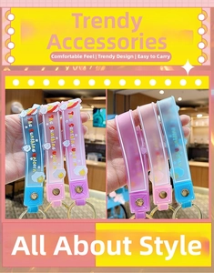 Close-up of colorful unicorn themed silicone wristbands with gold metal keyrings