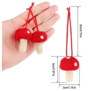 Handmade red felt mushroom Christmas ornament with white spots and hanging string