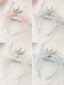 Detail of girls princess headbands with glitter crowns and mesh veils in four colors