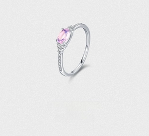 Detailed close-up of S925 sterling silver ring with pink zircon and micro-pave crystals