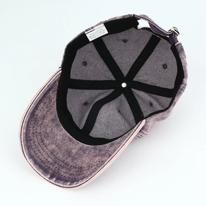 Faded purple washed cotton baseball cap with six-panel construction and metal buckle