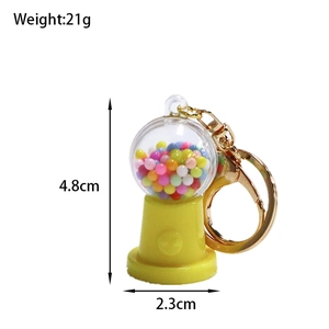 Mini candy machine keychain detail with 4.8cm height and 2.3cm base diameter specs