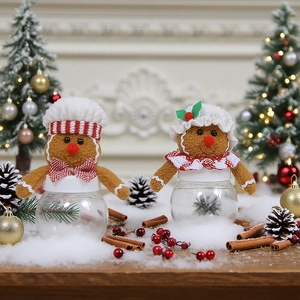 Christmas gingerbread man candy jars with plush chef hats and transparent bodies