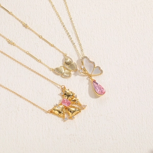 Luxury gold butterfly necklaces with shell inlays and pink crystal drop pendants