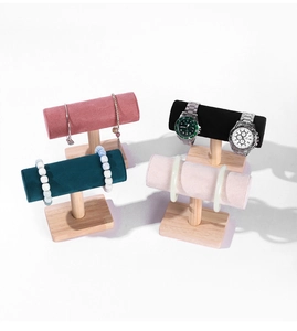 Detail of T-bar jewelry stands with velvet cylinders and solid wooden bases in four colors