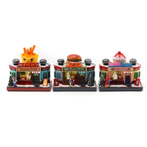 Set of three rotating glowing Christmas village music boxes featuring food stalls