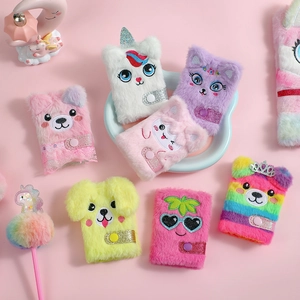 Flat lay of colorful plush animal notebooks with sequin snap closures on pink background