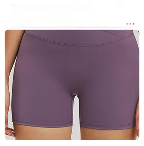 Close-up of lavender yoga shorts featuring a seamless front and cross waist design