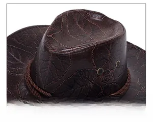 Macro view of dark brown western cowboy hat with leaf vein texture and braided cord