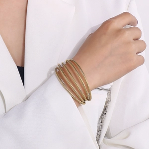 Fashionable gold layered C-shaped spiral cable cuff bracelet for women in a chic style