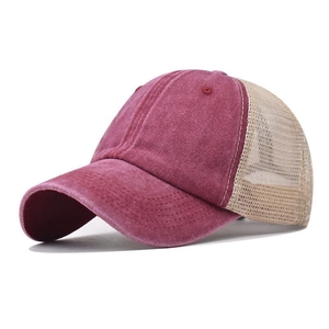 Detail view of burgundy washed cotton baseball cap with breathable beige mesh