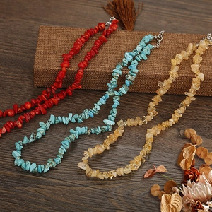 Detailed macro view of colorful natural irregular crystal stone beaded necklaces in three colors