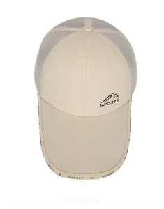 Macro shot of beige mesh baseball cap with mountain graphic and RSPORT brim text