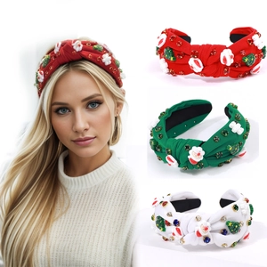 Detail of Christmas knot headbands with Santa decor and colorful rhinestones