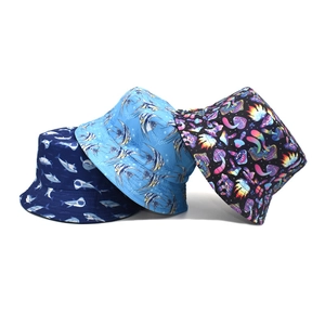 Three bucket hats with shark, fish, and mushroom prints for outdoor sun protection