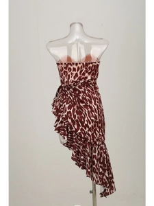 Detail of red-brown leopard print bandeau dress with asymmetrical ruffled hemline