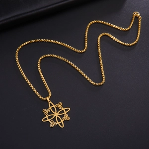 Close-up of golden Viking knot pendant with geometric cut-outs on a box chain