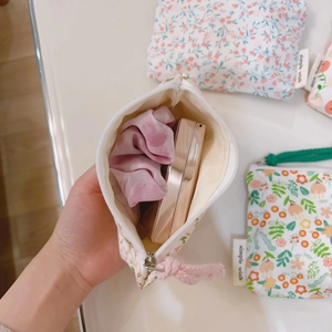 Floral cotton mini pouch for coins and makeup showing interior with scrunchie