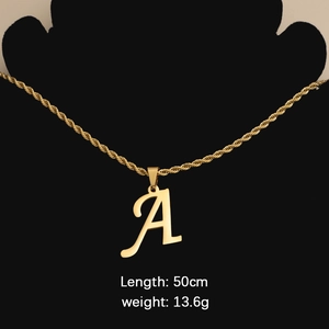 Elegant gold letter A pendant necklace with twisted rope chain on black mannequin