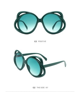 Detailed views of oval sunglasses with triple-layered green cutout frames and gradient lenses