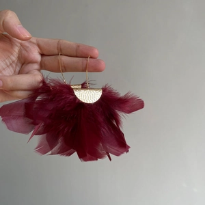 Vintage style burgundy feather tassel earrings with golden metal semi-circle accents