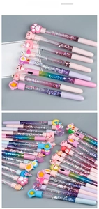 Close-up of colorful liquid glitter pens with cute cat paw and unicorn toppers