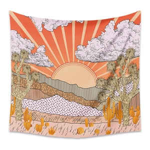 Detail of bohemian tapestry featuring hand-drawn desert sunset with Joshua trees and mountains