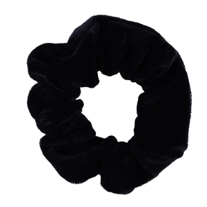 Detailed view of the soft black velvet texture on this elastic scrunchie hair tie