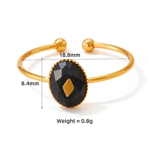 Golden open bangle with oval black faux onyx stone and diamond-cut facets for women