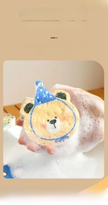 Close-up of wood pulp sponge generating rich foam with a cute cartoon bear design