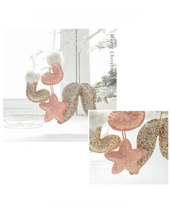 Detail of pink and gold Christmas hanging ornaments with fine glitter and textures