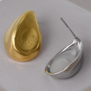 Detailed view of polished gold and silver water drop earrings in 304 stainless steel