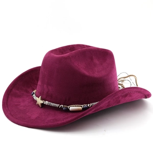 Detail of burgundy western cowboy hat with bohemian style beaded band and star buckle