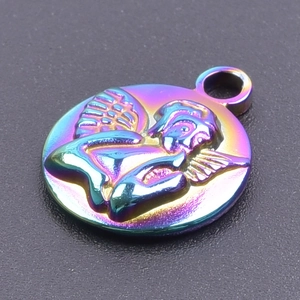 Macro shot of an iridescent rainbow stainless steel round pendant with embossed angel detail