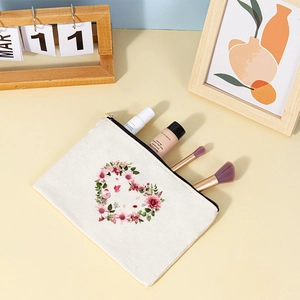 Detail of floral heart canvas bag showing smooth zipper and internal storage space