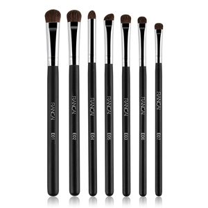Close-up of 7 professional eye makeup brushes with horse hair and black matte handles