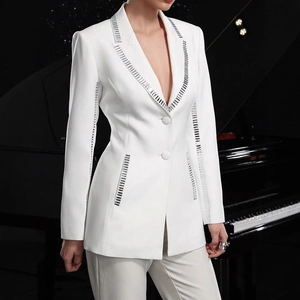 Detail of white slim-fit blazer with sparkling silver sequin accents and lapel design