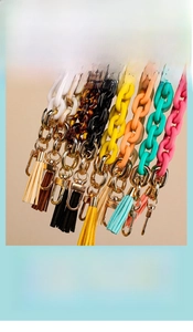 Detail of colorful acrylic chain with gold lobster clasp and matching silk tassel