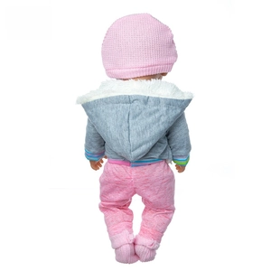 Detail view of doll plush winter coat and knitted hat in soft gray and pink textures