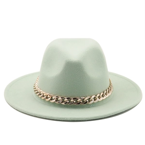 Detail of mint green wool fedora hat featuring a stylish thick gold chain decoration