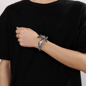 Detailed view of men's stainless steel bracelet with a punk scorpion bone design on wrist