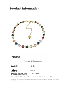 Detail of vintage tiger pendant necklace with colorful rhinestones and gold plating