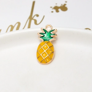 Macro shot of pineapple pendant made of yellow alloy oil drip for DIY jewelry making