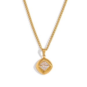 Detailed close-up of a vintage square pendant necklace featuring a sparkling zircon stone