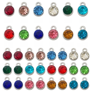 Detailed grid of 7mm multi-colored rhinestone birthstone charms with silver metal bases