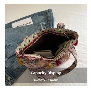 Spacious ethnic woven tote bag interior view with tassels and zipper closure detail
